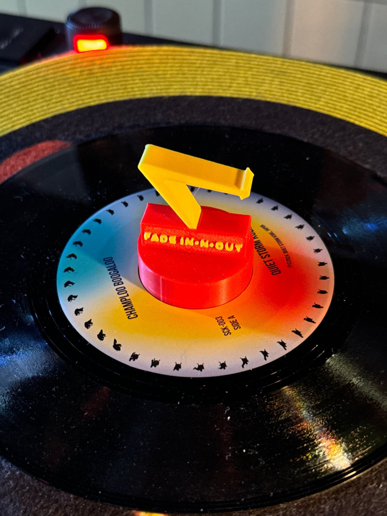 FADE IN-N-OUT adapter spinning on a 7-inch record