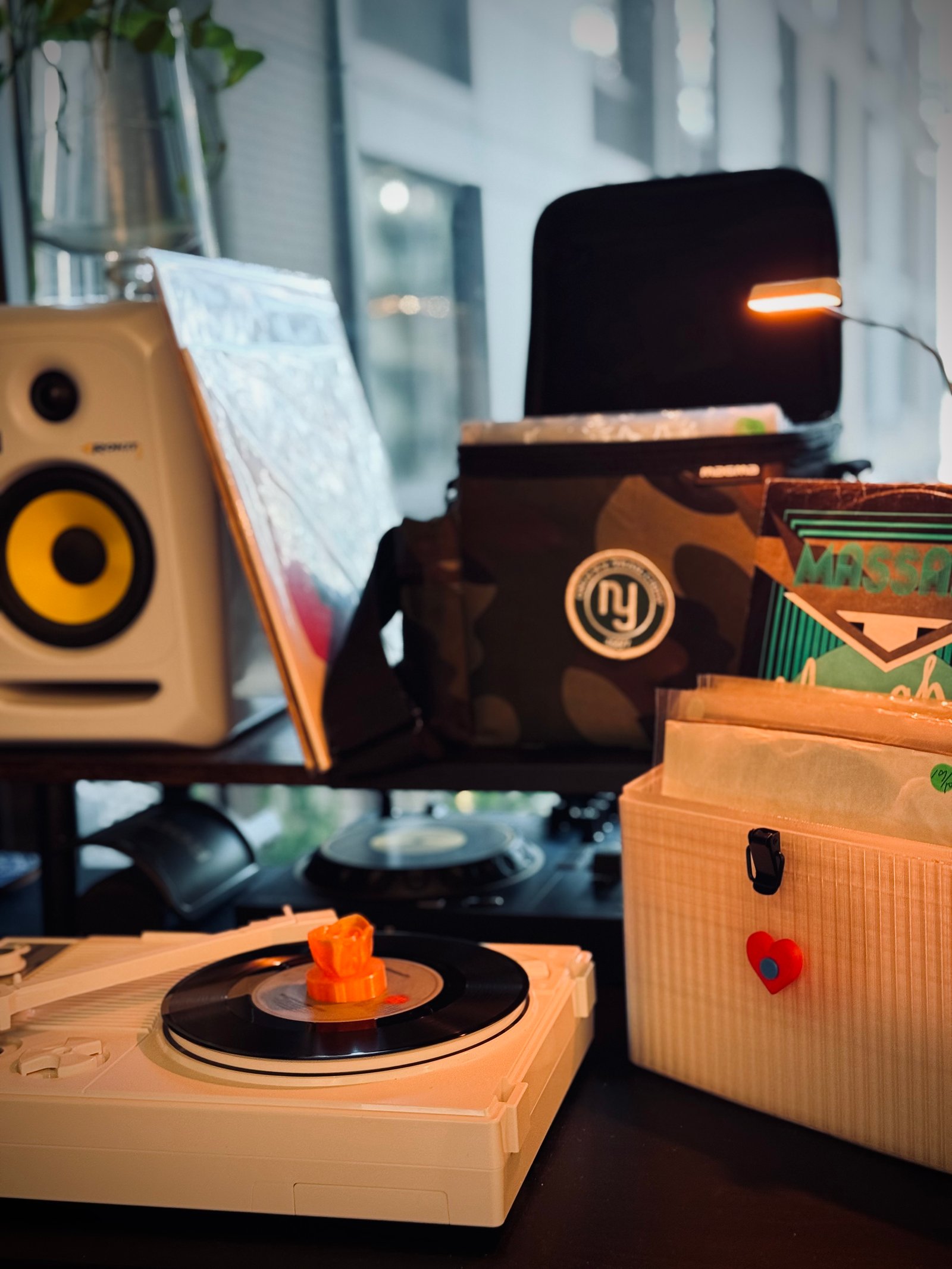 Adapter in a real DJ setup with KRK monitors and record crates